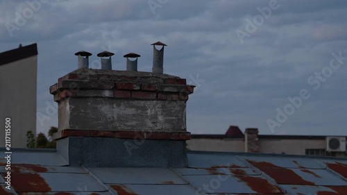 Old Brick Chimneys on the roof of a vintage house.
