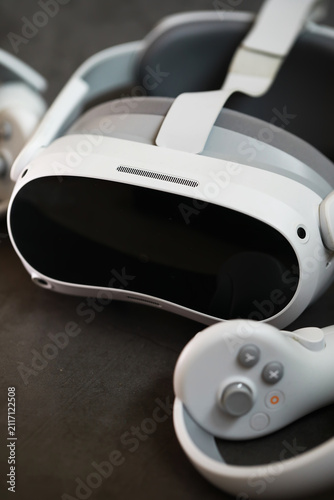 Modern Virtual Reality Headset and Controller on Dark Surface