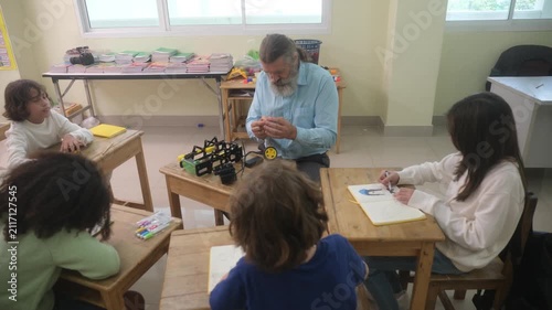 The children are conducting experiments with electric motors.