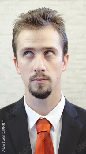 Businessman rolls eyes in slow motion