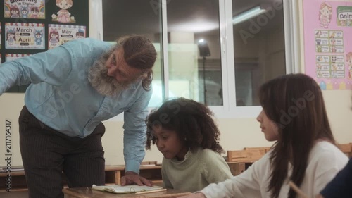 The teacher is teaching the students in the classroom.