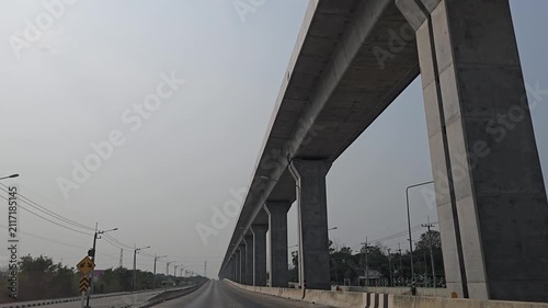 Driving in highway and elevated railway. Lopburi Province, Thailand.