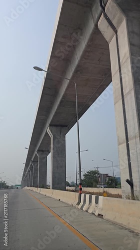 Driving in highway and elevated railway. Lopburi Province, Thailand.