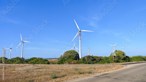 Canvas Print Wind turbines generating clean electricity on a sunny day