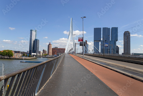 ROTTERDAM, NETHERLANDS, JULY 17, 2025 - Overview of the Rotterdam skyline with the famous Erasmusbrug, also known as The Swan in Rotterdam, Netherlands