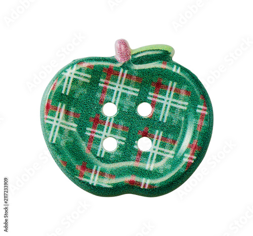 Apple shaped glittery green plaid sewing button with red pattern isolated on white background