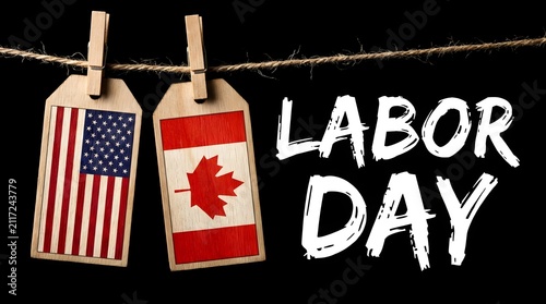Conceptual image featuring flags of the united states and canada hanging on a clothesline to celebrate the annual holiday of labor day canada and america