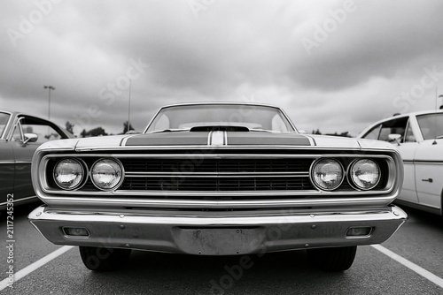 The Classic Car Front View: Vintage Musclecar Grille and Chrome Bumper