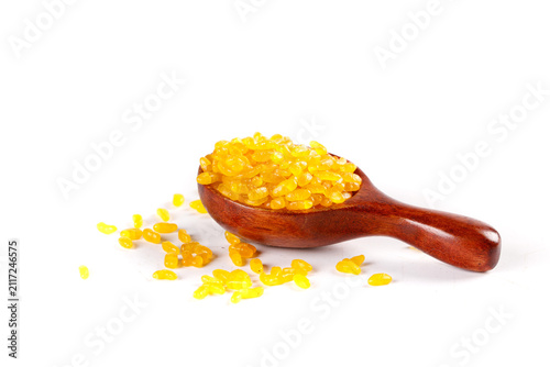 Foto Golden Enriched Cereals Grains with Selenium in Wooden Spoon Healthy Nutrition F