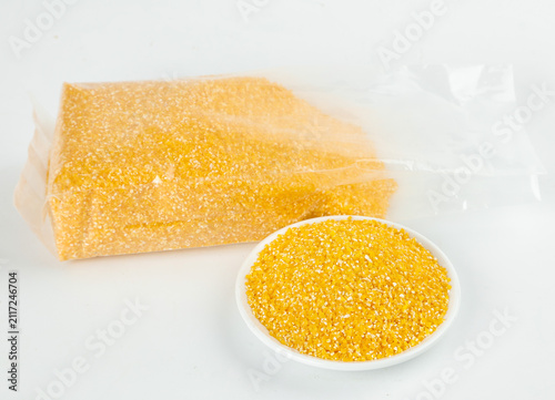 Konstfotografi Yellow Cornmeal Polenta Block and Ground Corn Grits for Traditional Cooking and