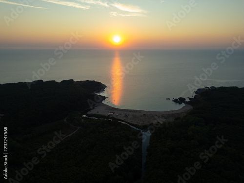 Drone Flying Forward Over Silistar Beach Bay at Golden Sunrise Sunset