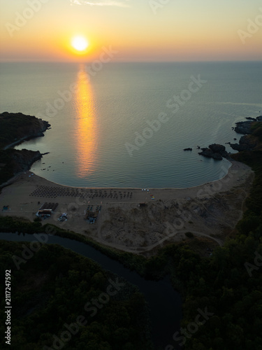 Drone Flying Forward Over Silistar Beach Bay at Golden Sunrise Sunset