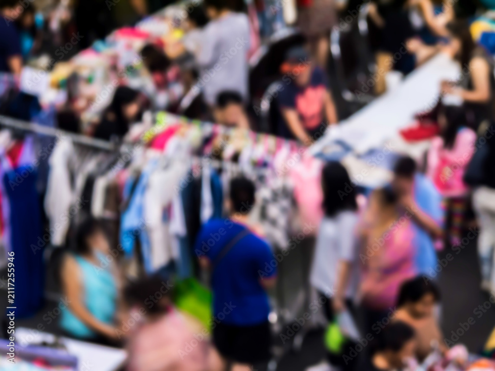 Fototapeta premium Blurred traditional clothes market.