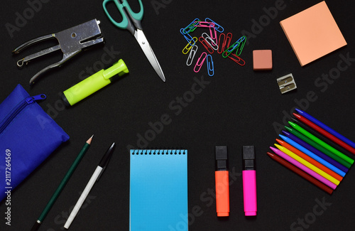 Back to school, black background, materials and creativity.	