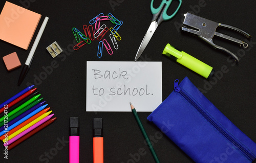 Back to school, black background, materials and creativity.
