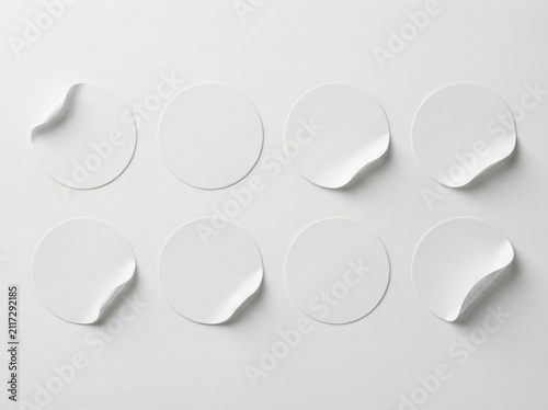 Blank white round stickers mockup isolated on white surface