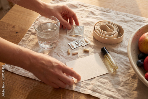 Natural Health Supplements And Aromatherapy Oil Arranged On A Linen Fabric Surface