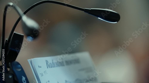Close up of a microphone and sheet music, classical music concert, 4k