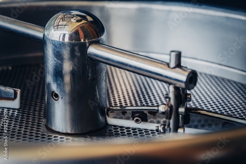 Fotografía Close up of a stainless steel agitator inside a coffee roasting drum during roasting process