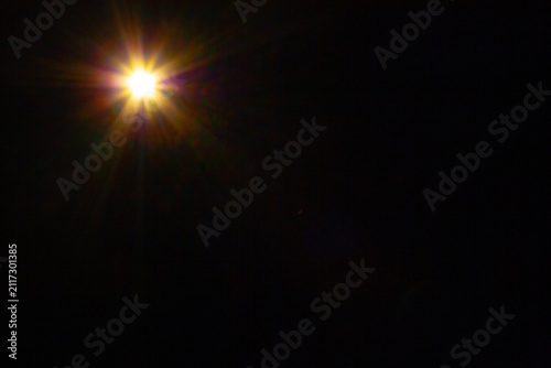 Sun flare on the black background