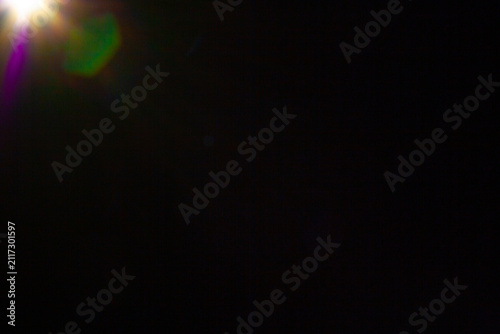 Sun flare on the black background