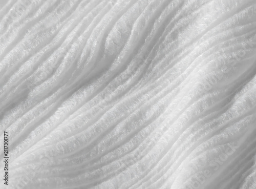 High quality abstract white paper texture featuring soft wavy folds and subtle light gray shadows