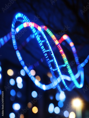 Abstract Bokeh Background with Colorful Neon Light Spirals and Festive Night Illumination