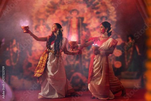 Bengali women performing dhunuchi dance on the occasion of Durga Puja