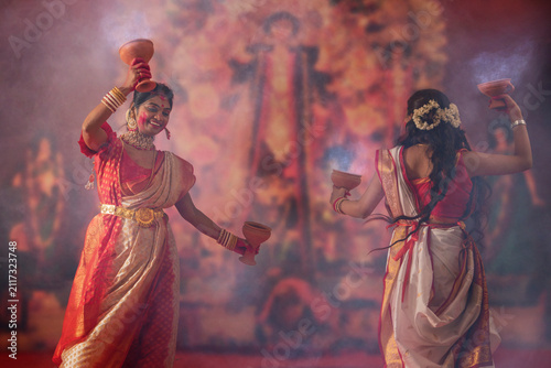 Bengali women performing dhunuchi dance on the occasion of Durga Puja