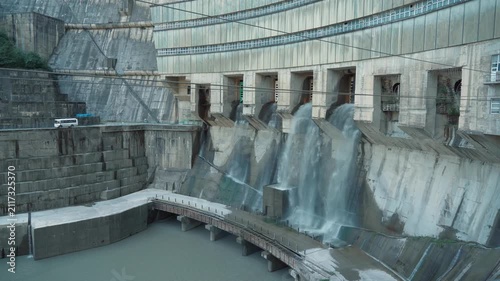 Enguri Hydropower Plant spillway releasing water through concrete dam, Georgia renewable energy infrastructure for hydroelectric generation and water management.