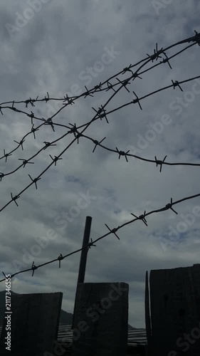 Low angle vertical shot of barbed wire fence at a former gulag camp in Ust-Nera Russia