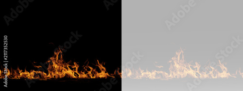 Fotografía Fire burning with intense orange flames spreading low and rising into a bright f