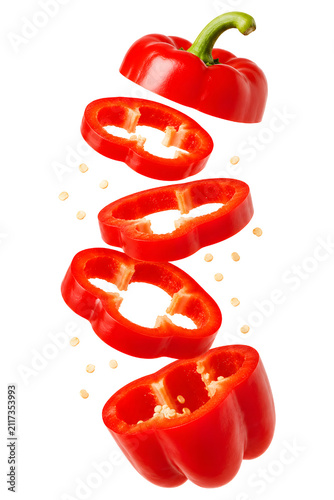Red bell pepper slice floating isolated on transparent background.