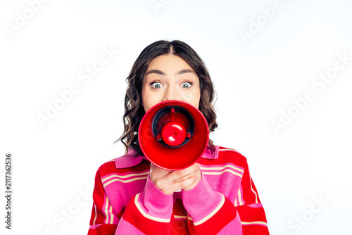 Fotografie Young woman shouting into red megaphone to grab attention for announcement, prom