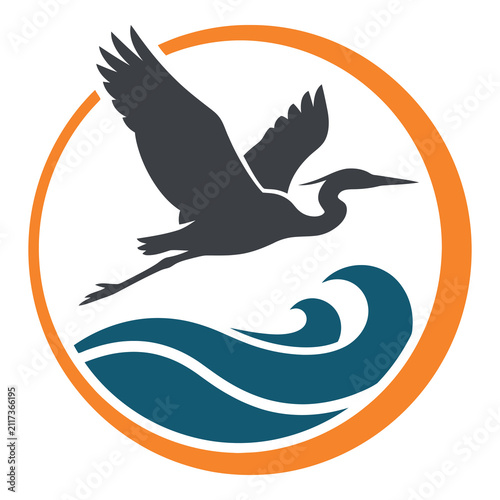 Gray heron flying over blue ocean wave in orange circle logo design icon