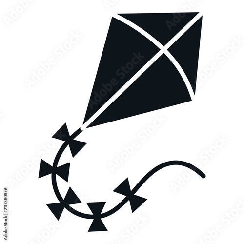 Foto Kite flying in the air with a long tail and streamers attached to it outdoors ic