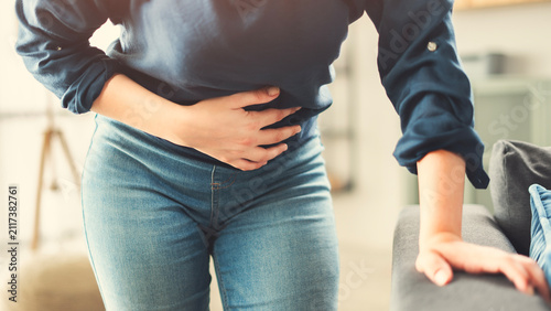 Fotografie Young woman with stomach ache