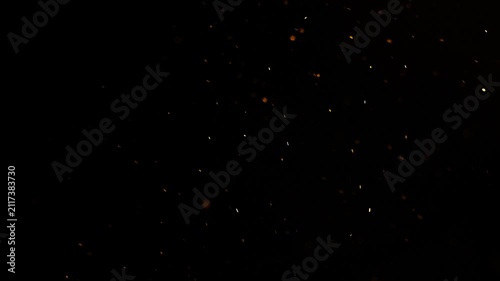 overlay of six different scenes of multitudes of incandescent embers scattered by the wind.