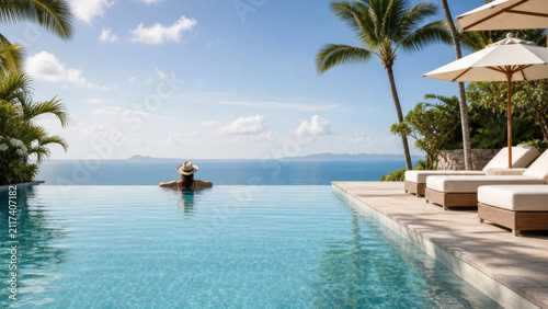 Tropical resort pool with ocean view, palm trees, and lounge chairs under umbrellas, peaceful vacation scene with clear blue sky