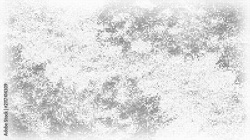 Abstract pattern of black dots creating a textured visual effect on a white background