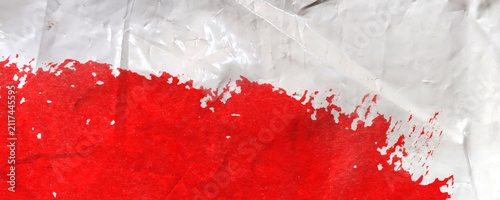 Foto Red paint smear on white crumpled plastic background texture surface