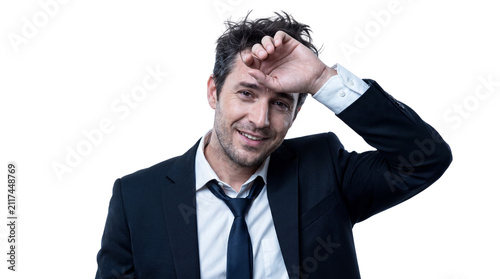 Relieved Businessman Wiping Sweat with Messy Hair After Productive Work Day