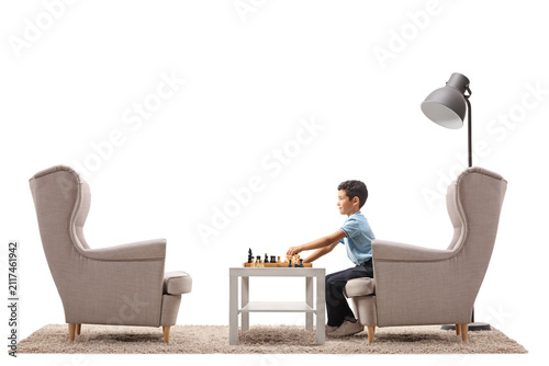 Boy playing chess alone