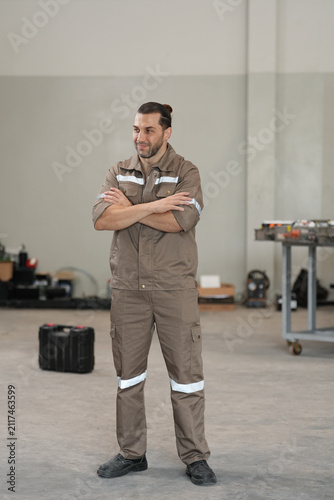 Mechanic workshop uniform worker car garage maintenance repair male technician standing with crossed arm in service area