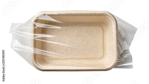 Foto Rectangular beige paper food container sealed with clear plastic film, isolated