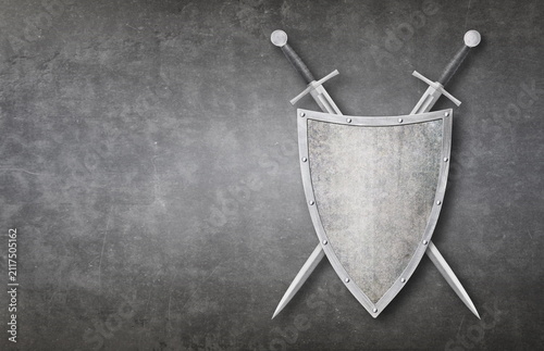 knight swords and shield on grunge background
