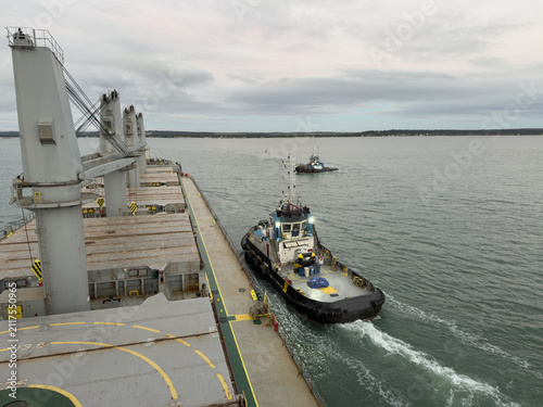 Canvas Print tug boat approach ship for assistance. mooring operation.