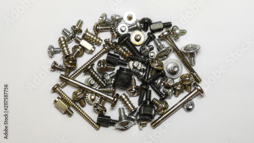 Fotografía Assorted computer screws, bolts and metal standoffs isolated on white background