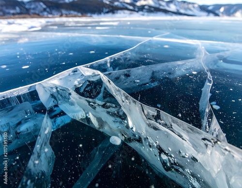 Close-up of cracked ice on frozen Lake Baikal in winter with blue tones