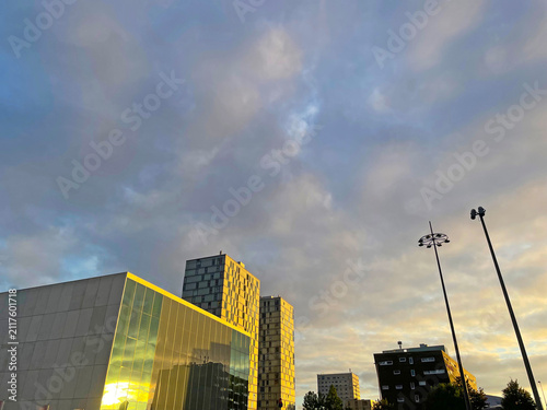 The modern city of Almere in a bright blue cloudy sky, at sunset  Almere, Flevoland, the Netherlands, July, 2026